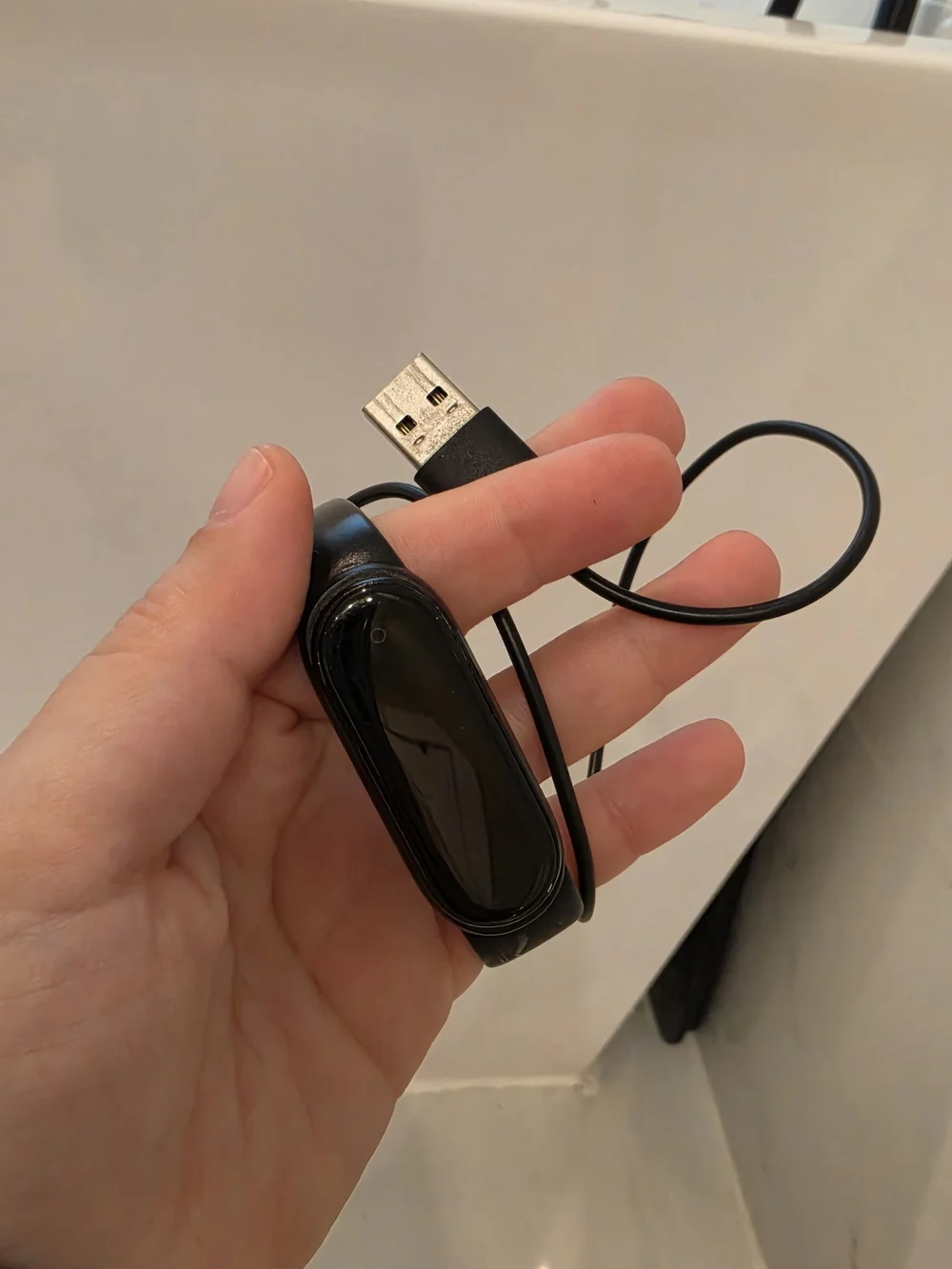 Black Fitness Tracker with USB Charging Cable